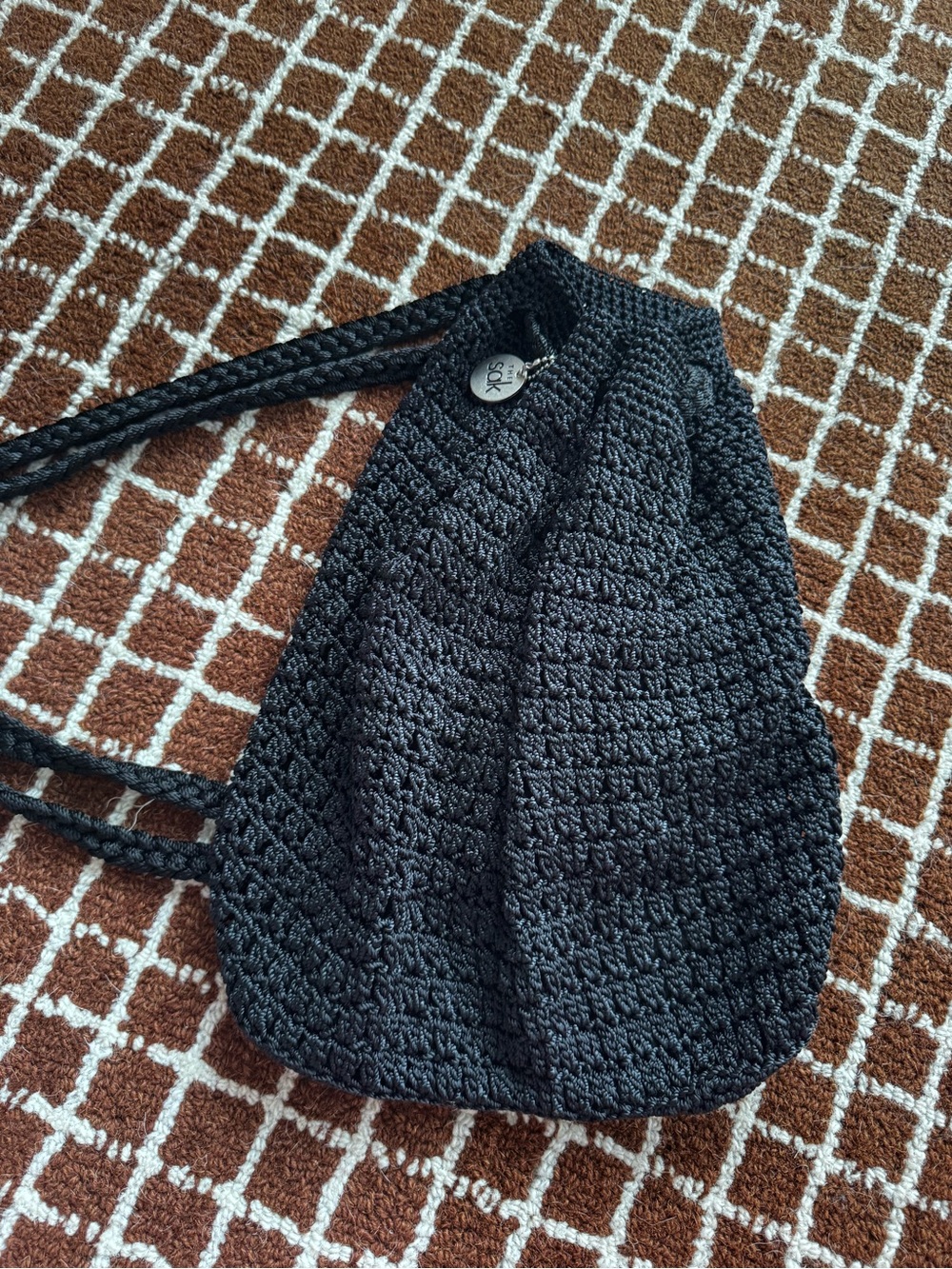 The Sak Black Crochet Drawstring Backpack